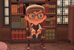 My Animal Crossing character looking, as my youngest daughter informed me, like a stereotypical trans boi in slacks, a shirt with a vest, large round glasses, and a paper boy hat. He sits on a rocking chair in front of a bookshelf.